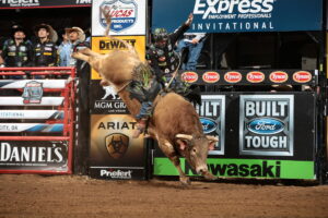 LJ Jenkins attempts to ride D&H Cattle Company's Margy Time during the championship round of the OKC Built Ford Tough series PBR. Photo by Andy Watson