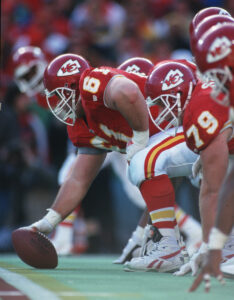 Kansas City Chiefs center Tim Grunhard (61) gets ready to hike the ball during a 1993 NFL game.