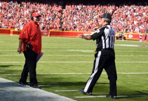 Oct 11, 2015; Kansas City, MO, USA; Kansas City Chiefs head coach Andy Reid argues with head linesman George Hayward (54) about a penalty called in the second half against the Chicago Bears at Arrowhead Stadium. Chicago won the game 18-17. Mandatory Credit: John Rieger-USA TODAY Sports