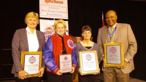 Inductees: From left, former University of Missouri women’s basketball coach Joann Rutherford, President’s Award winner Jodie Adams (former director of the Springfield-Greene County Park Board), former Lockwood and Pleasant Hope high school volleyball coach Cheryl Shores and Evangel University women’s basketball coach Leon Neal. Not pictured – former Missouri Southern State University Athletic Director Sallie Beard.
