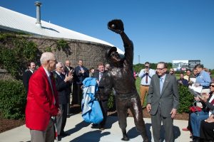Bill Virdon, red jacket, reacts as the cover to his larger-than-life statue is revealed Thursday, May 25, 2017.