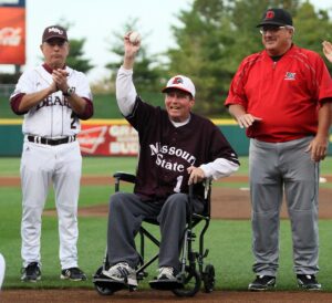 Coach Howard Bell throws the first pitch out at "The Battle for Bell" with Missouri State coach Keith Guttin (left) and Drury coach Mark Stratton (right) on Saturday evening at Hammons Field.  Courtesy Jesse Scheve - MSU Photo Services.