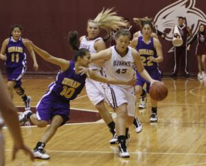 2010 45 Morgan Smith dribble Kayla Messick in background w ponytail